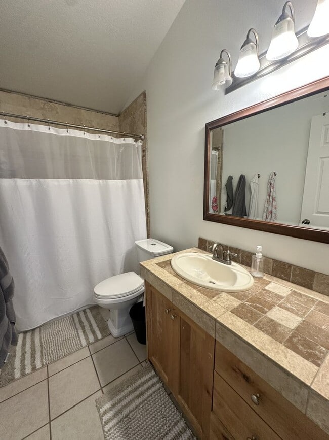 Building Photo - Large 4 bedroom end unit with fully fenced yard is a must see!!