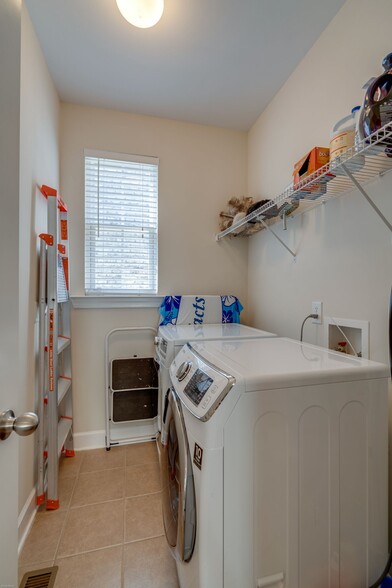 Laundry room on main floor - W/D not included - 7752 Porter House Dr