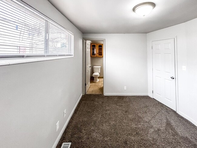 Building Photo - Spacious 5-Bedroom Home with Lofted Garage