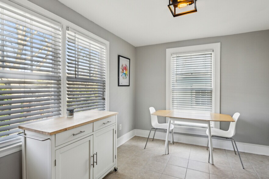 Large eat in kitchen includes gas stove, dishwasher, microwave and ample storage - 1118 Colquitt Ave NE