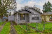 Building Photo - CUTE AND COZY TWO BEDROOM WITH GARAGE