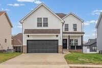 Building Photo - Pet Friendly Three Bedroom with Bonus!