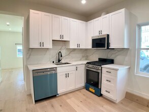 Building Photo - FULLY Remodeled. BRIGHT! In-Unit W/D, Stainless Appliance Package, MODERN!