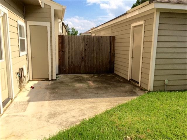 Large patio with locked storage area attached to home. - 23619 Twisting Falls Drive