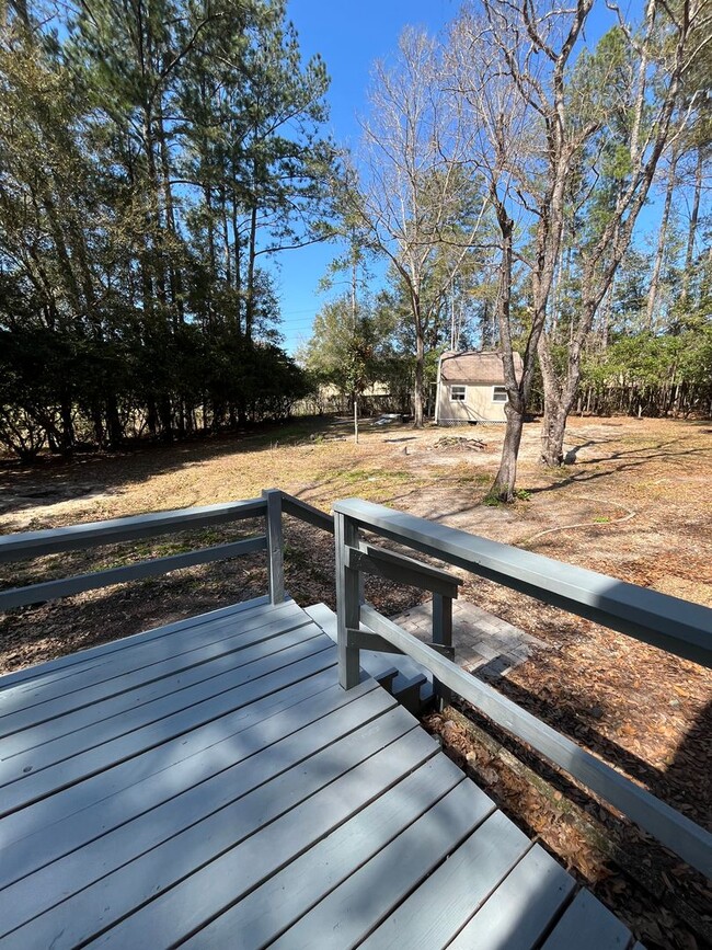 Building Photo - 3/2  home fenced in backyard located acros...