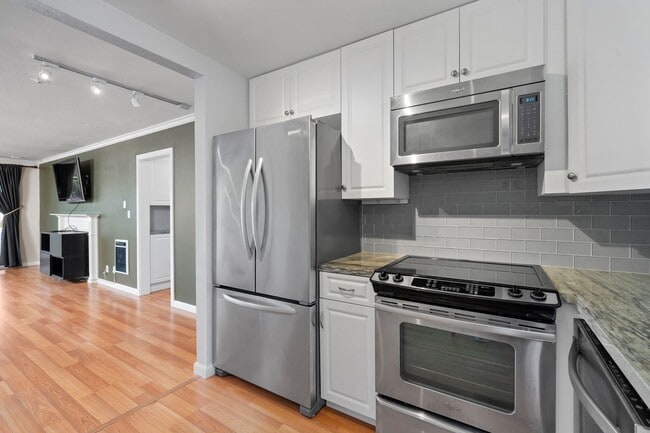 Building Photo - Available now! Updated Versailles Condo in Newport Beach