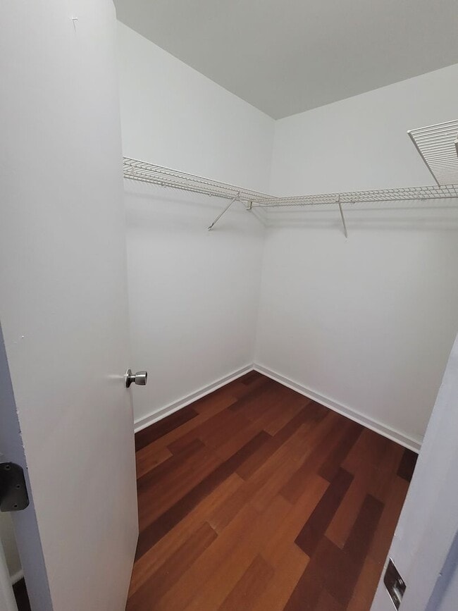 Building Photo - Located in Caneel Cove this 2 bed 2 bath townhome features hardwood floors throughout ,