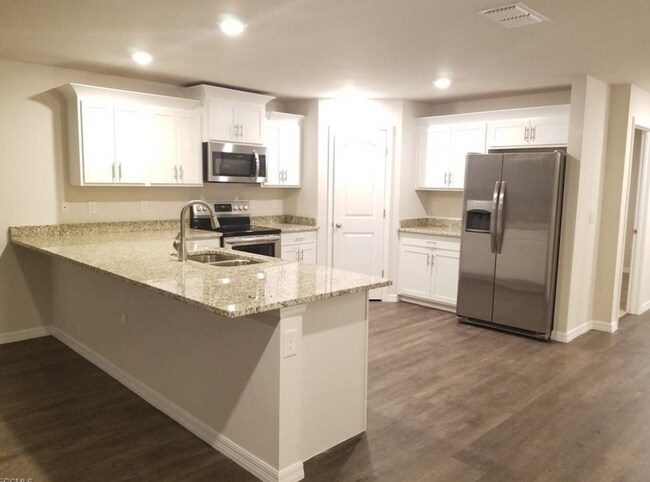 Building Photo - AVAILABLE NOW! NW CAPE CORAL - 3 Bedrooms - 2 Bathrooms - 2 Car Garage