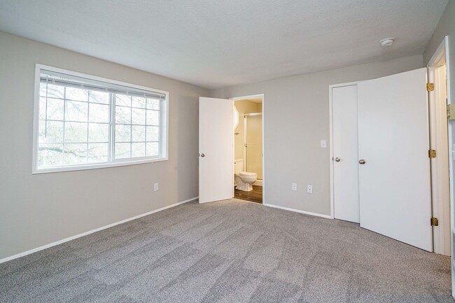 Building Photo - Recently Updated with Wood Laminate Flooring and Fresh Paint
