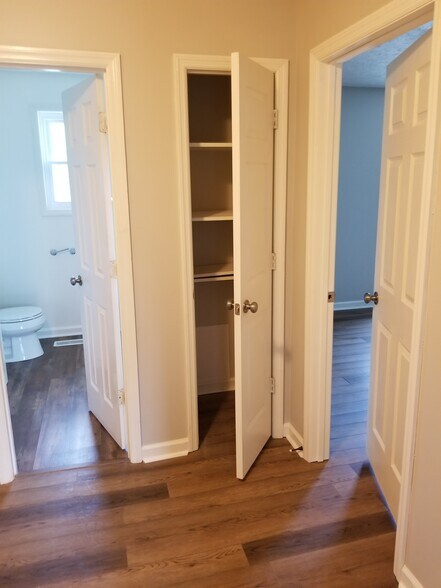 Upstairs looking towards full bath, closet, and master bedroom - 1445 Toshiba Drive, #B