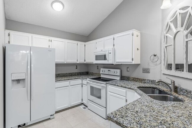 Building Photo - NW - Updated Home with Granite Counter-tops, Fire Place, Deck, Storage Building, Garage!