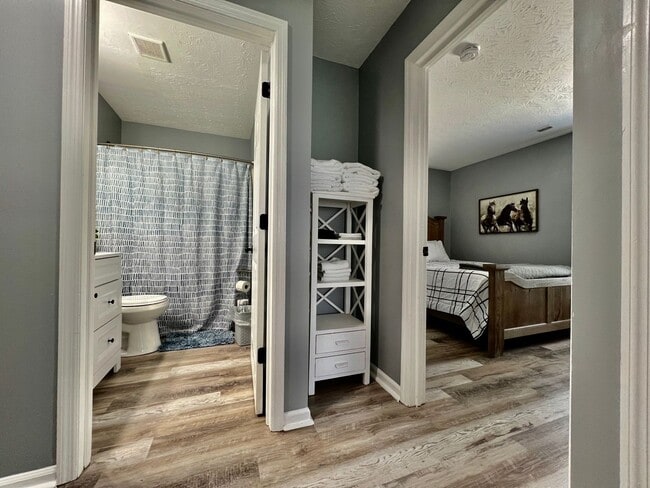 Building Photo - 3 bedroom home w/ privately fenced yard + hot tub.