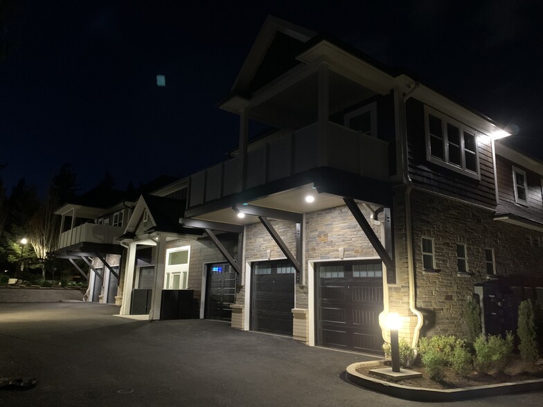 Resident garages at night - 16600 Boones Ferry Rd