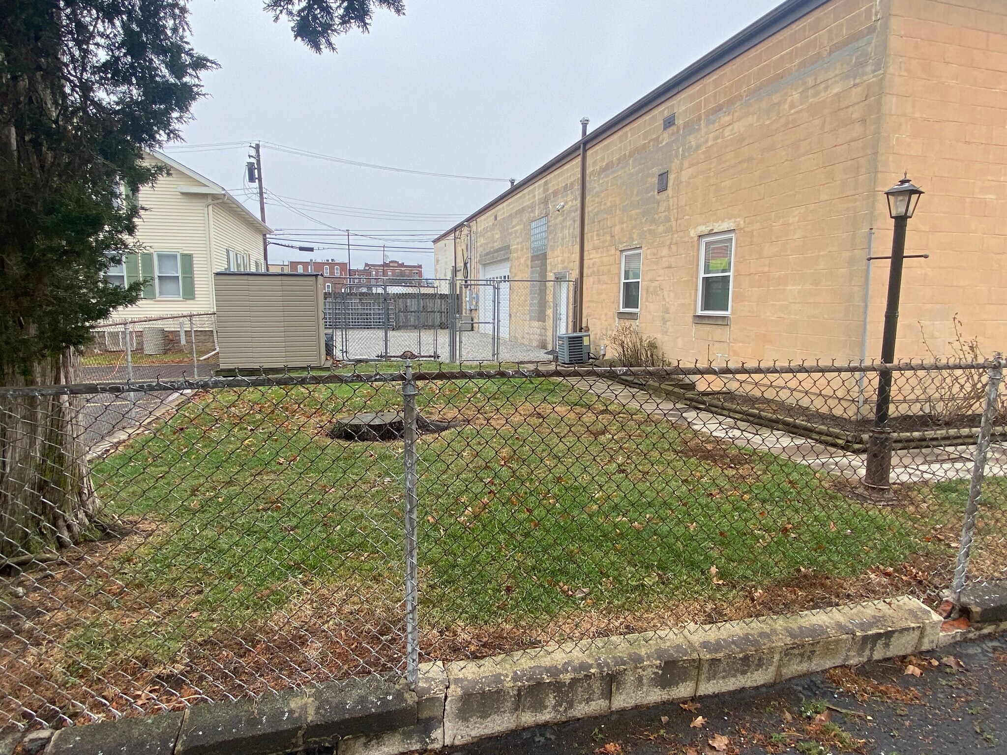 Small fenced yard with storage shed - 246 S Prospect St
