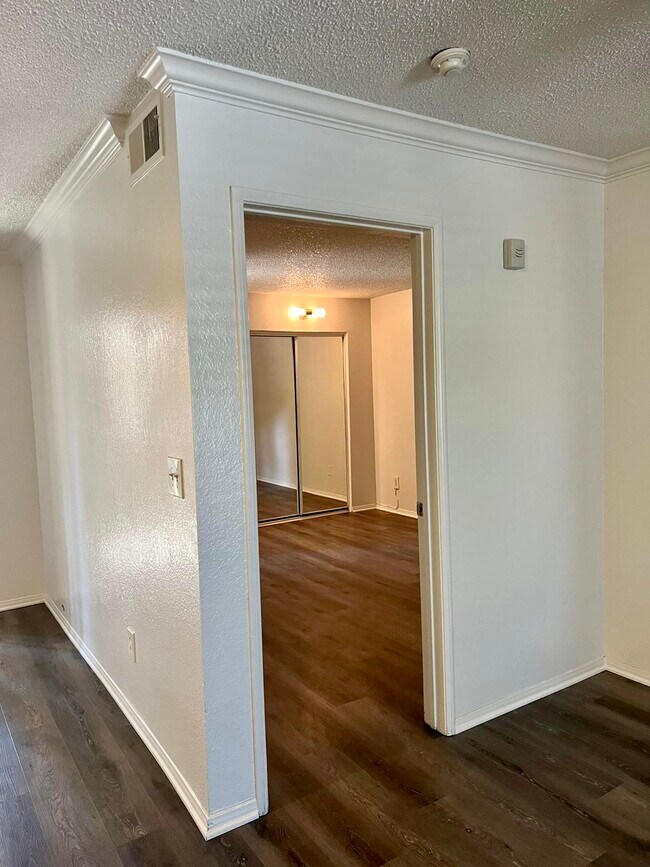 Master bedroom with mirrored closet doors - 10655 Lemon Ave