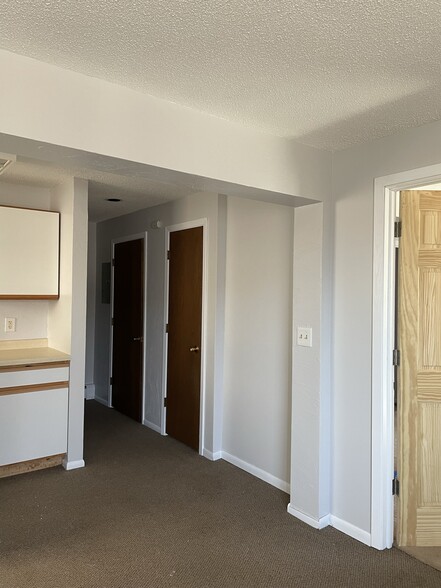 Hallway to bathroom, closet, and utility room - 1209 E 4th St
