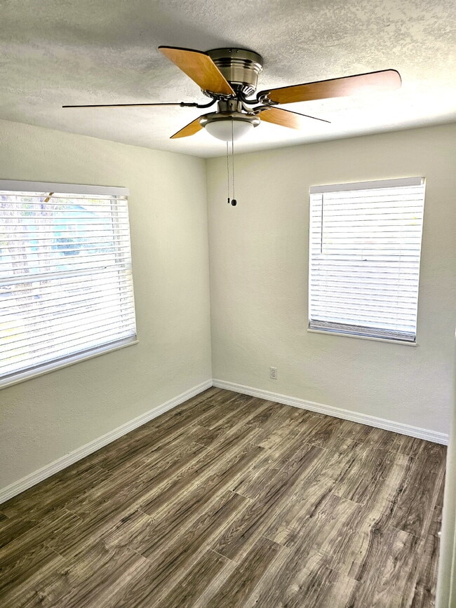 Building Photo - fully renovated 2-bedroom, 1-bathroom home with bonus guest room or office and oversized fenced yard