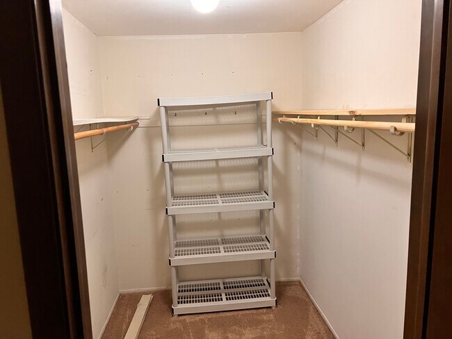 Master bedroom walk in closet. - 4315 Lindenwood Dr
