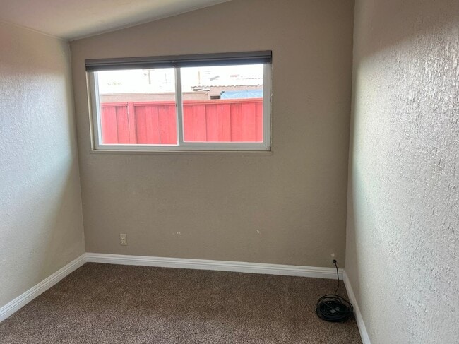 Building Photo - UPDATED BRIGHT OPEN LAYOUT LARGE BACK YARD...