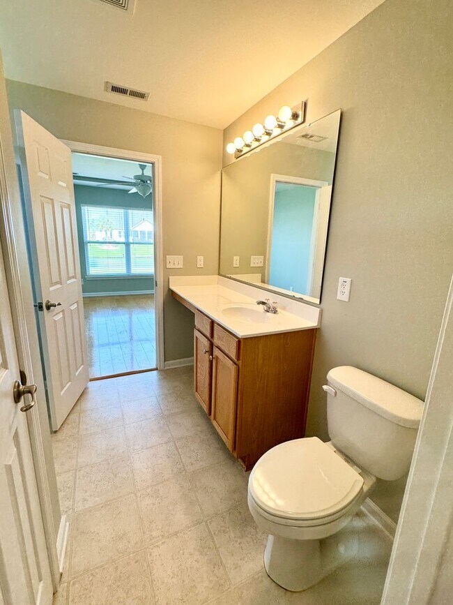 Building Photo - Like New 3 Bedroom & 2 Bath pond front home in Hillsborough! Enjoy the Community Pool, Playground...