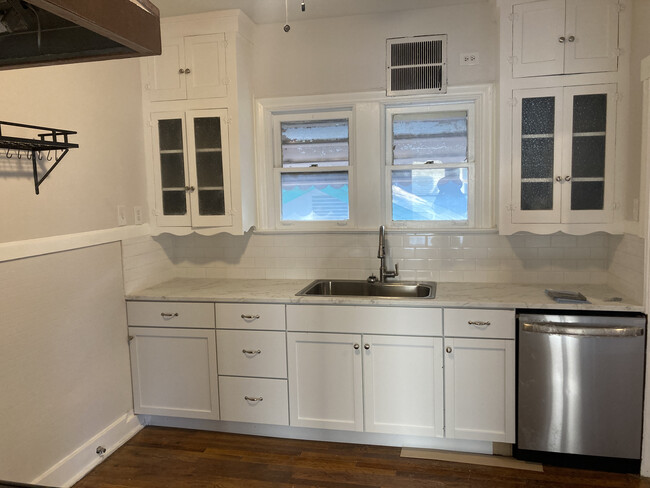 Contemporary kitchen retains the 1920s glass-front upper cabinets - 266 Post Ave