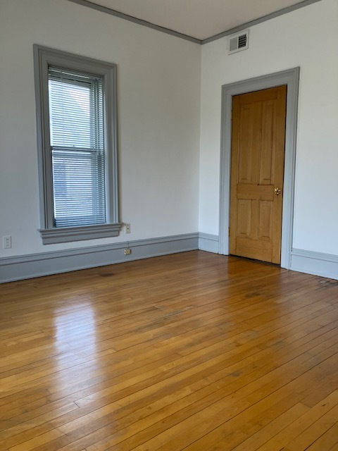 Large bedroom with wood floors - 916 N Church St