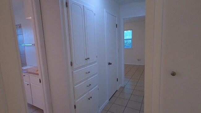 Hall view from primary bedroom door - 415 W Guthrie St