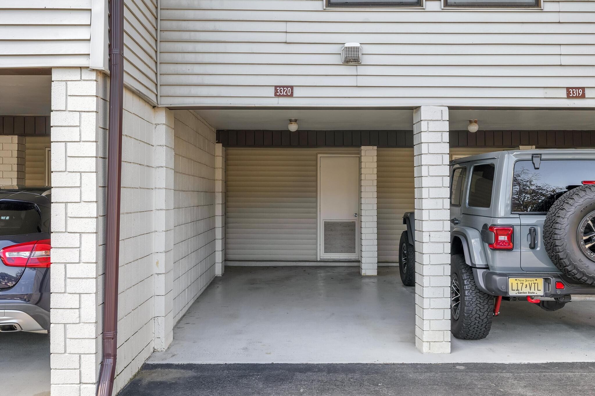 Convenient carport with designated parking spaces for added comfort and protection. - 3320 Richmond Ct