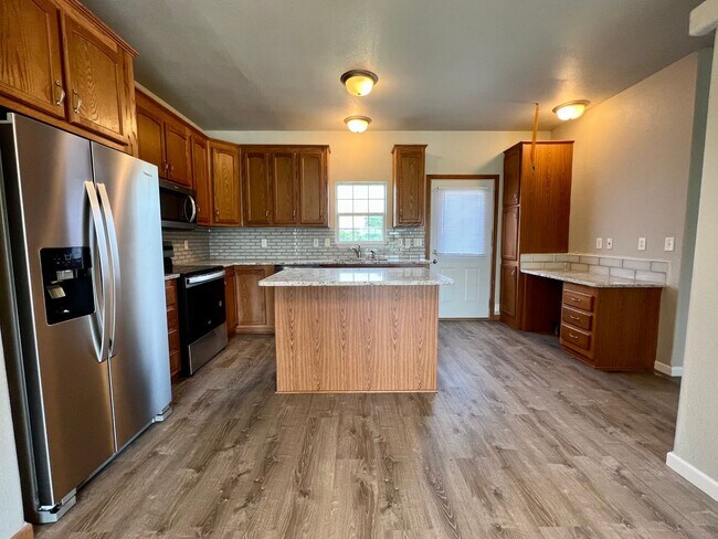 Building Photo - Fully Remodeled 3 Bedroom | 2.5 Bath Townhome – Great Location off K-18!