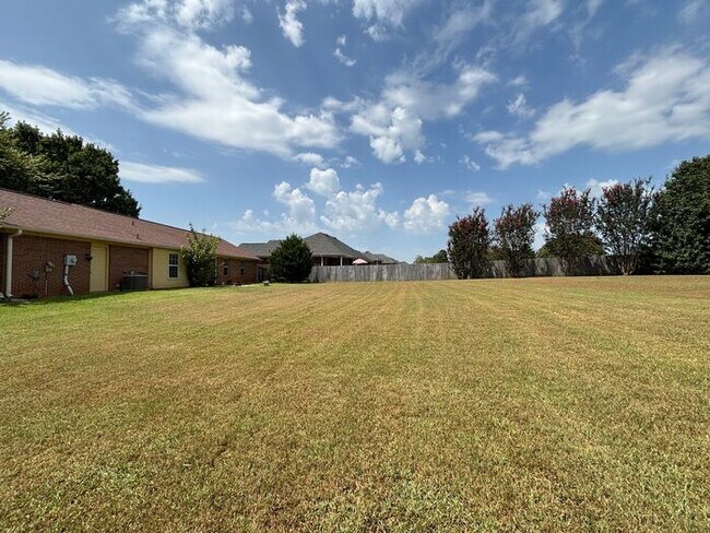 Building Photo - You will LOVE the fenced yard!