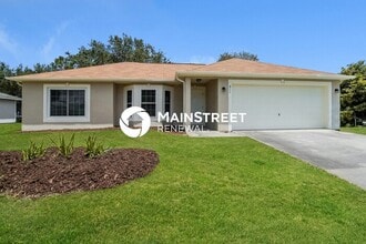 Building Photo - 4 Bedroom Pet-Friendly Home in Palm Bay, FL with Main Street Renewal