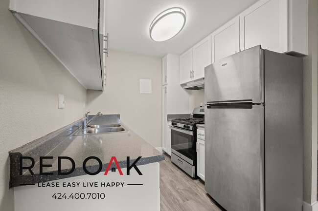 Building Photo - Sun-Drenched Two Bedroom with Stainless St...