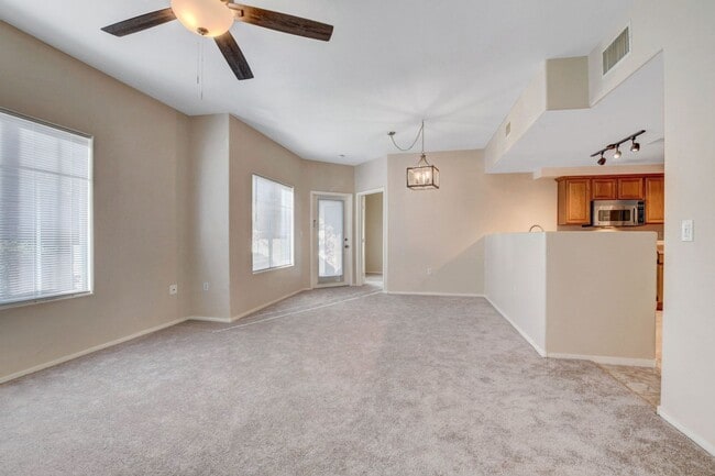 Building Photo - FIRST FLOOR CONDO IN GATED COMMUNITY W/ SINGLE CAR GARAGE