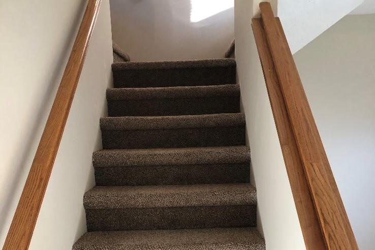 Stairway to upstairs bedrooms - 13305 Discovery Dr
