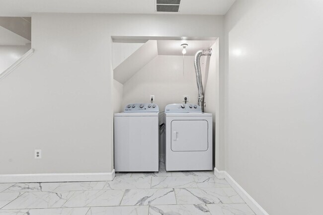 Building Photo - Experience contemporary living in this beautifully renovated residence where modern design meets ...