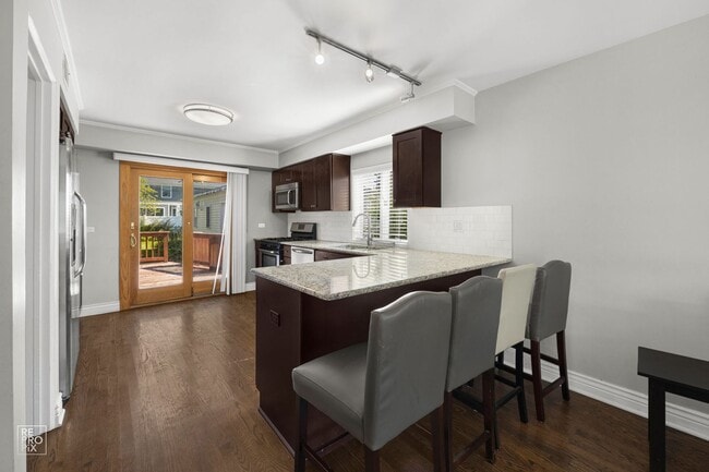 Building Photo - Elmhurst Three Bedroom Home with Fenced Yard and Detached Garage