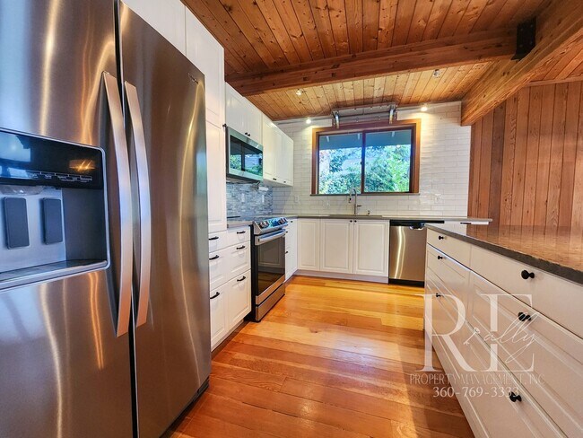 Building Photo - Waterfront Living in Indianola – Dock, Bea...