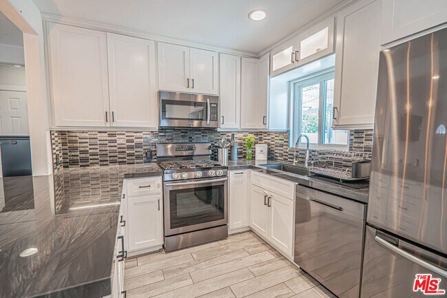 Building Photo - 7044 Garden Grove Ave
