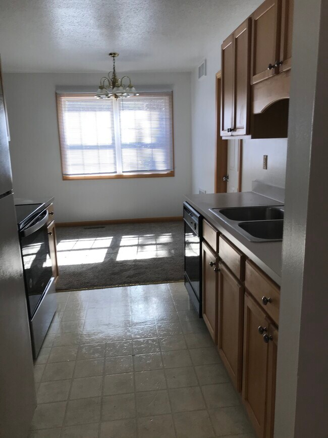 Kitchen into dining room - 5340 Cider Mill Rd
