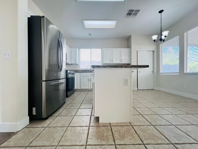 Building Photo - REMODELED, SPACIOUS, 4 BEDROOM HOME WITH VAULTED CEILINGS AND LOFT