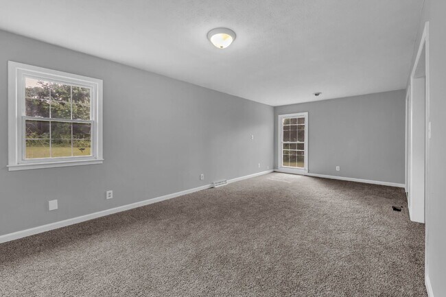 Building Photo - spacious 4-bedroom, 2.5-bath home featuring a 2-car garage and fresh updates throughout.