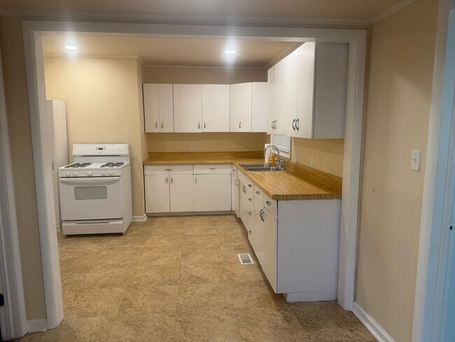 Building Photo - Step into this beautifully updated 1950's gem, where charm meets modern convenience