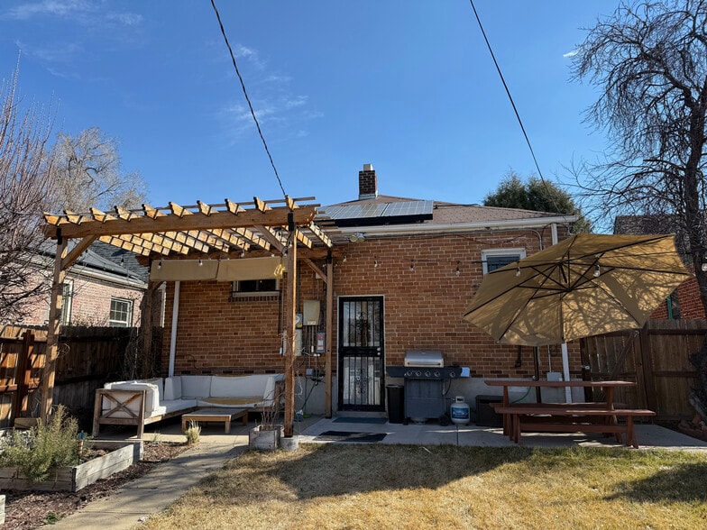 Backyard showing pergola and solar panels - 3423 N Saint Paul St