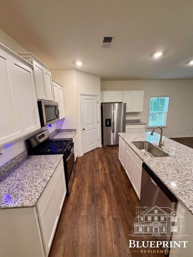 Building Photo - Single story living 2025 build with custom layout and many upgrades! Private backyard! Available ...