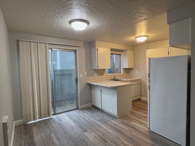 Building Photo - NEWLY REFRESHED Two Bedroom Townhome Style...