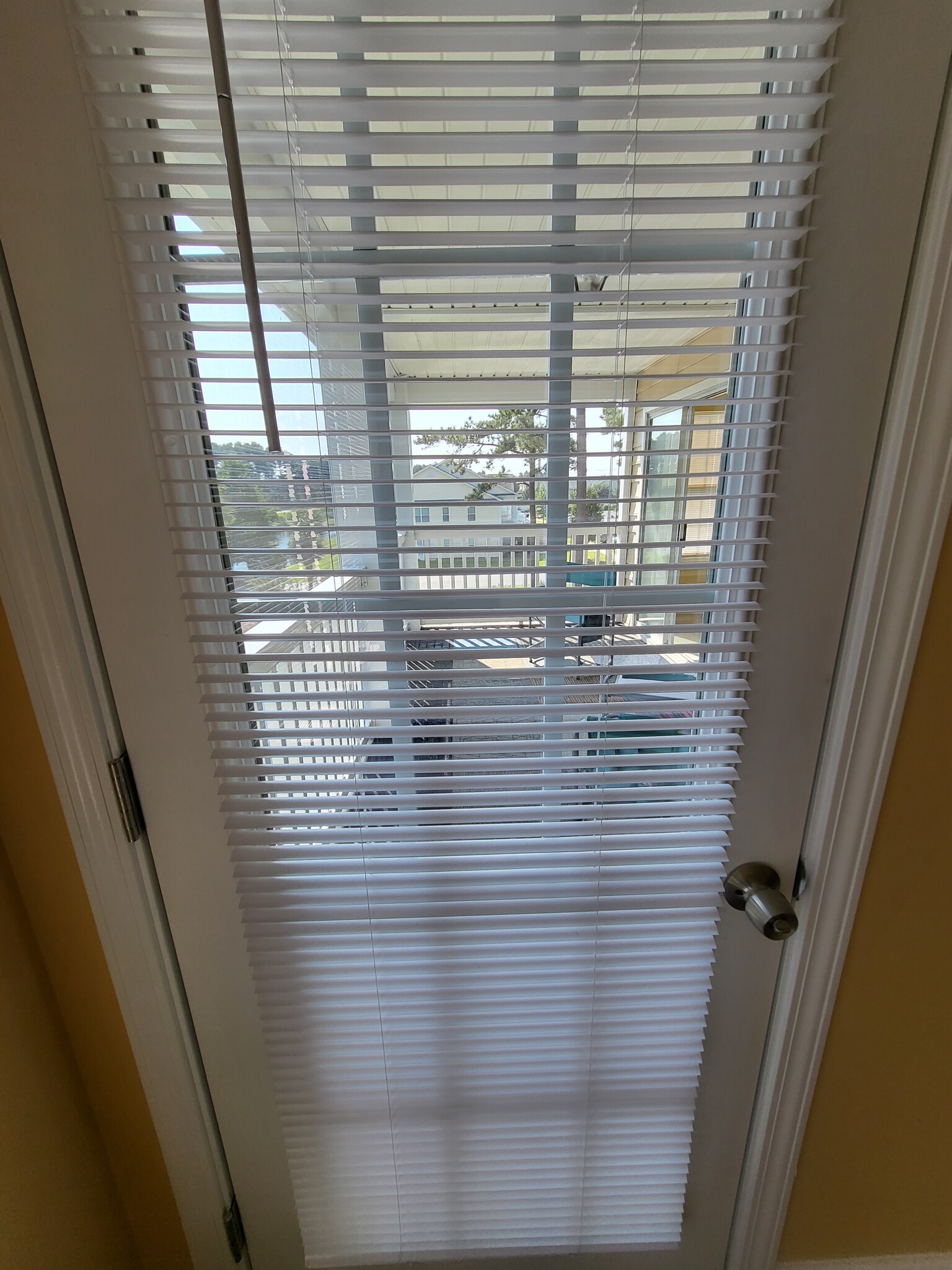 French Door leading from primary bedroom to the lanai - 4910 Windsor Green Way