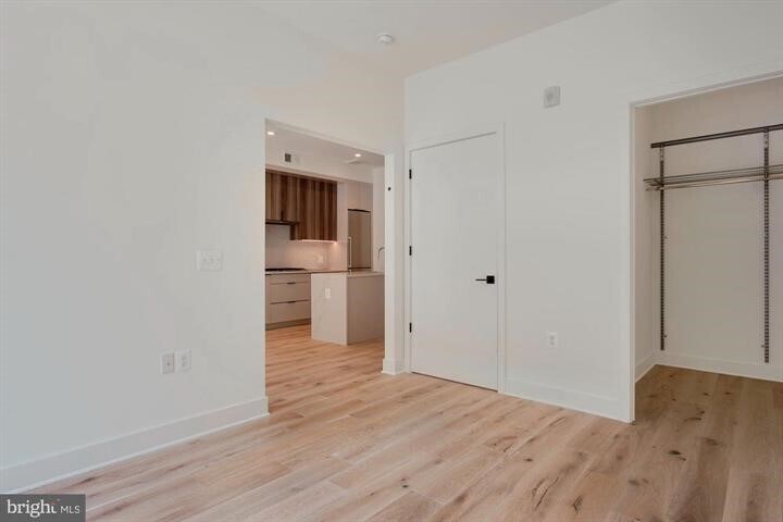 Walk-in closet in the primary bedroom. Three large closets in the unit. - 801 N St NW
