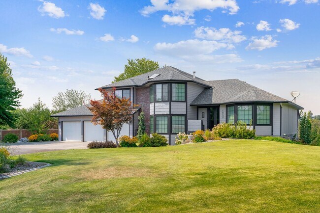 Building Photo - Stunning Home and Three Bay Shop Along Spo...