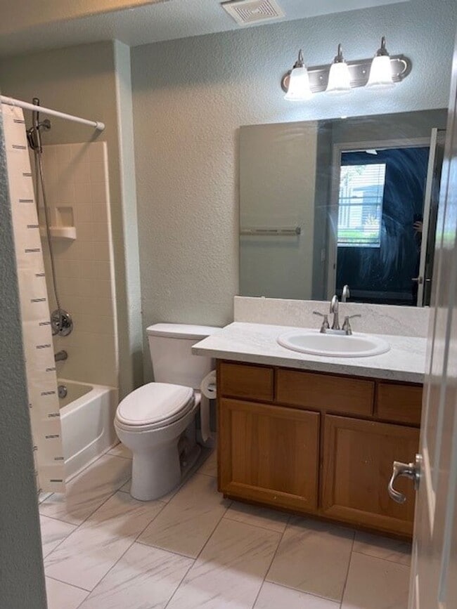 Building Photo - Beautifully updated condo in gated community. Sparkling pool. Stainless steel appliances and lami...
