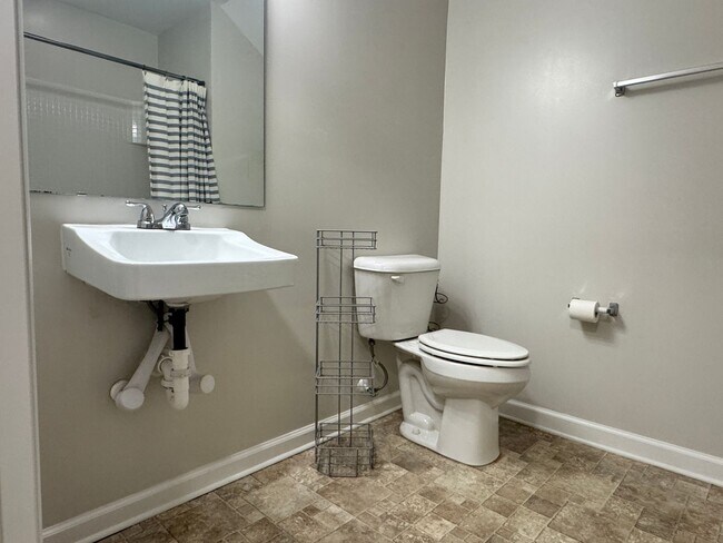 Building Photo - Beautiful, Conveninetly located First Floor Condo